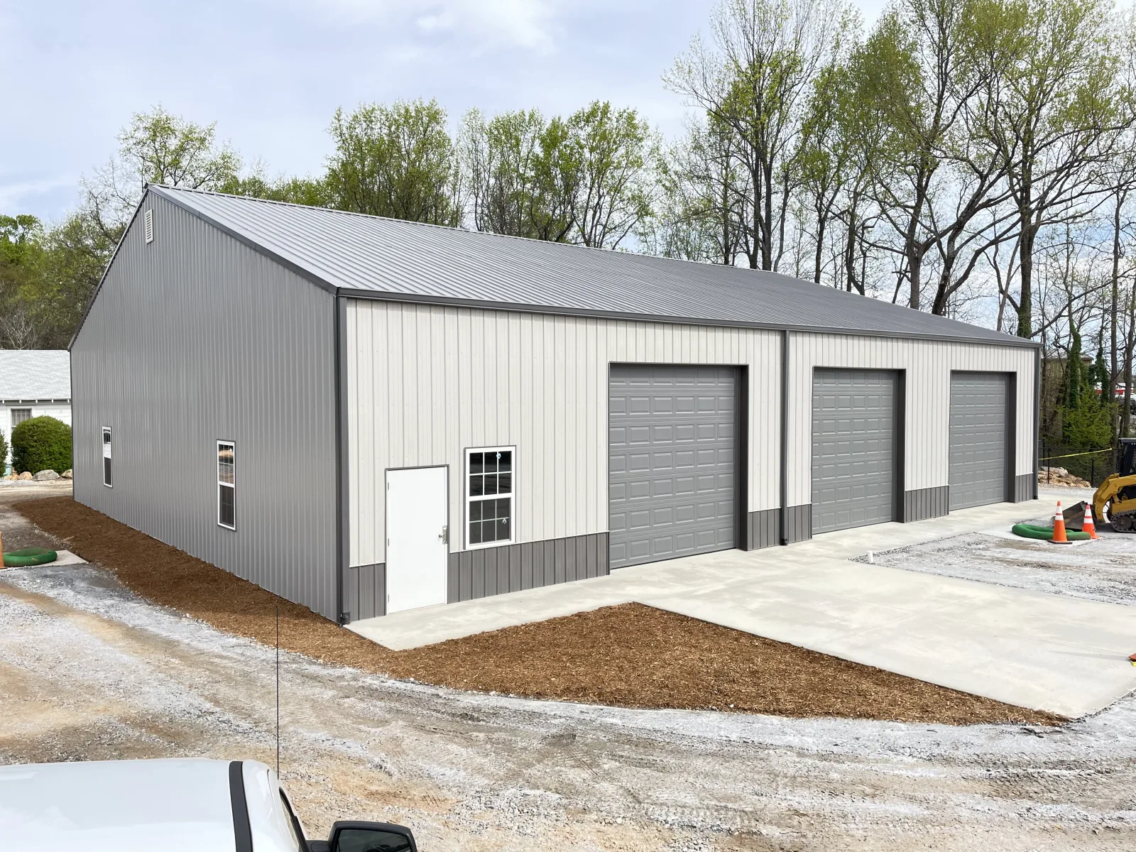 Large steel building with three 12x12 overhead doors built by Hoover Buildings