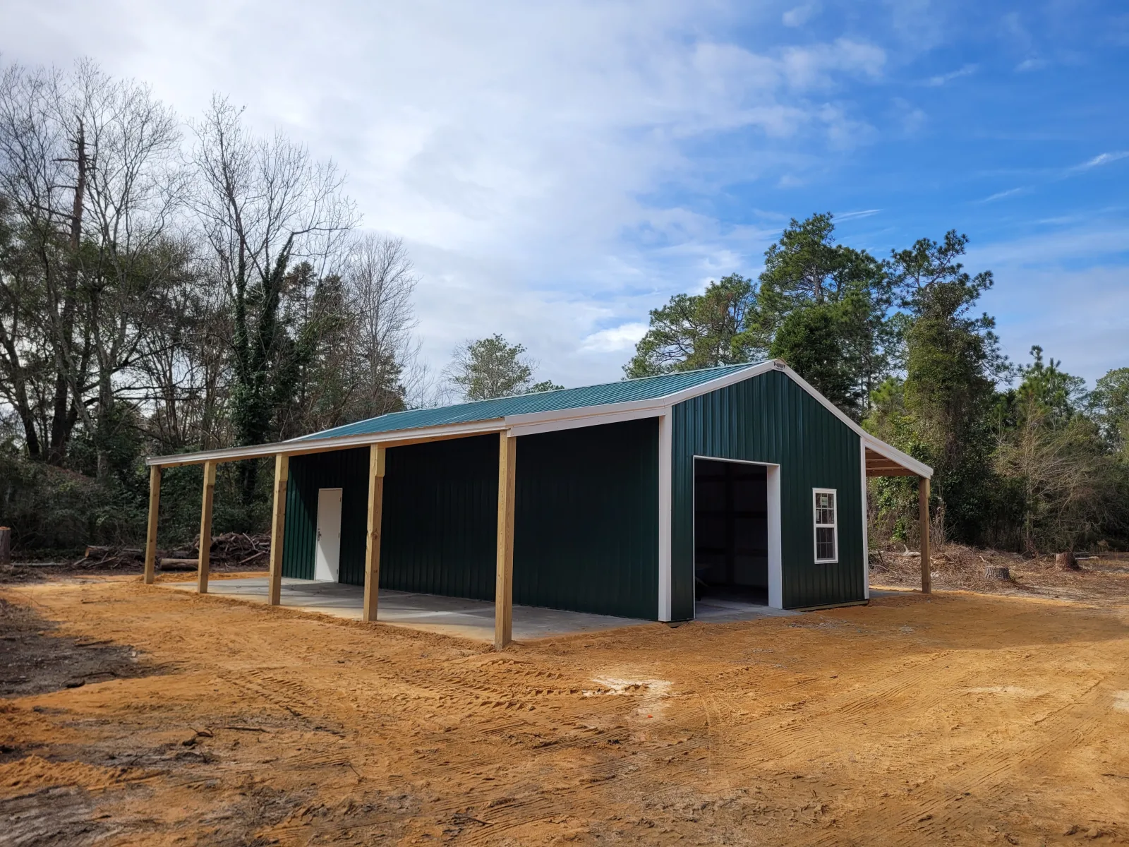 Pole building with a forest green roof and walls, built by Hoover Building Systems in Newberry County, SC